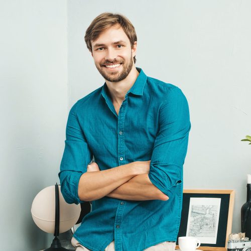portrait-of-young-handsome-man-posing-in-the-offic-resize.jpg